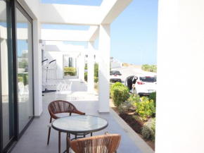 Homely 2-bedroom apartment with garden and sea view